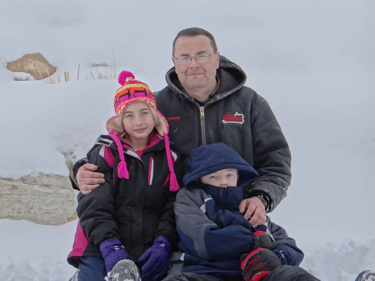 Spencer with children in the snow